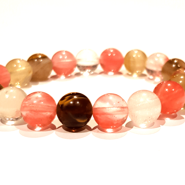 Close up of Handmade Light-Hearted Bracelet – Tourmalinated Quartz Bracelet for Positivity on white background