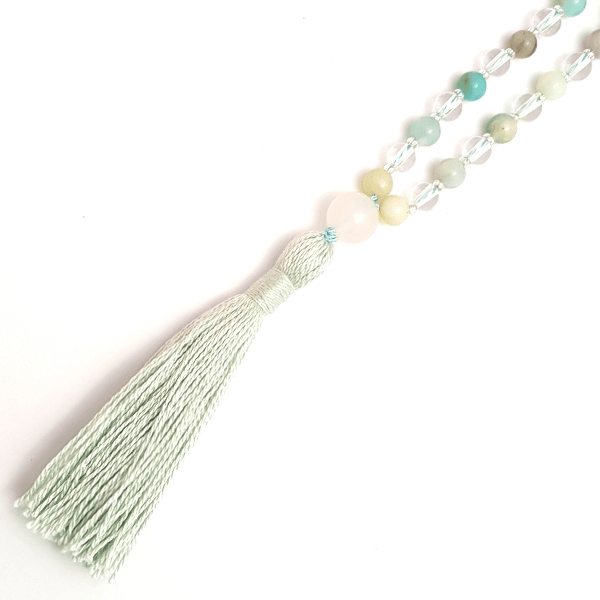 Close up of handmade Affirmation Mala Necklace – Amazonite, Quartz & Rudraksha tassel