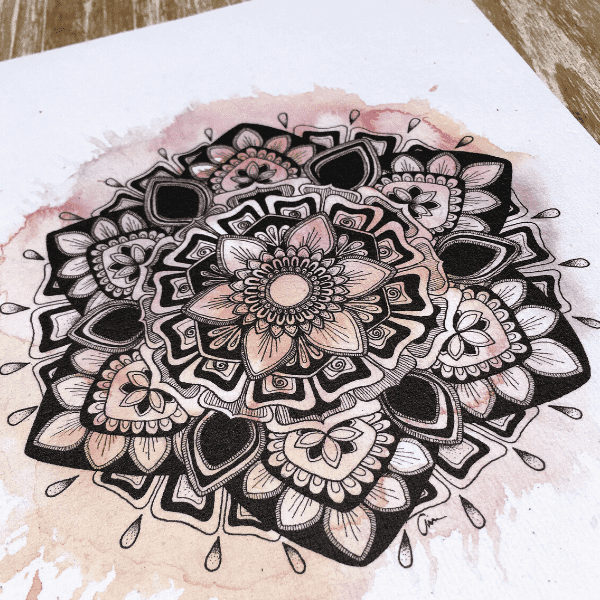 Close up of spring mandala design with pink water colour background designed by Aimee Fergusson