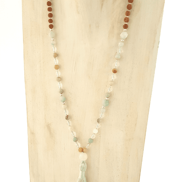 Close up of handmade Amazonite, Quartz and Rudraksha Affirmation Mala Necklace  on jewellery bust