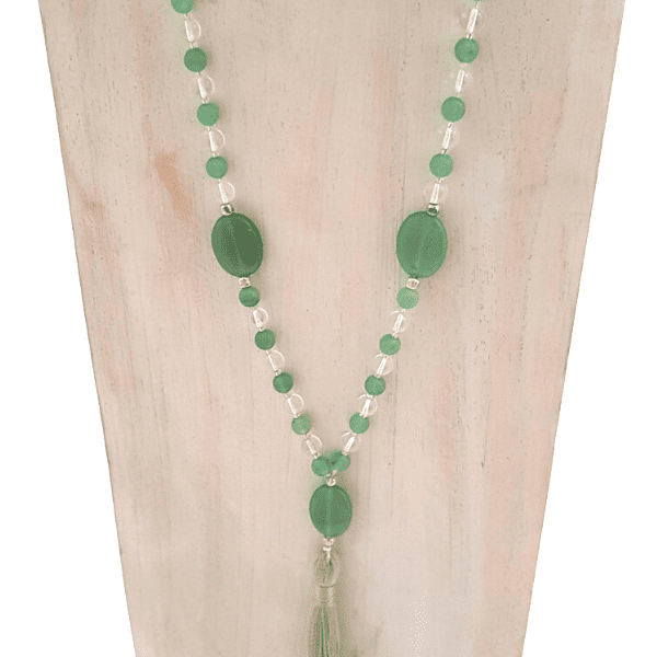 Close up of handmade Green Aventurine and Quartz Good Fortune Mala necklace on jewellery bust