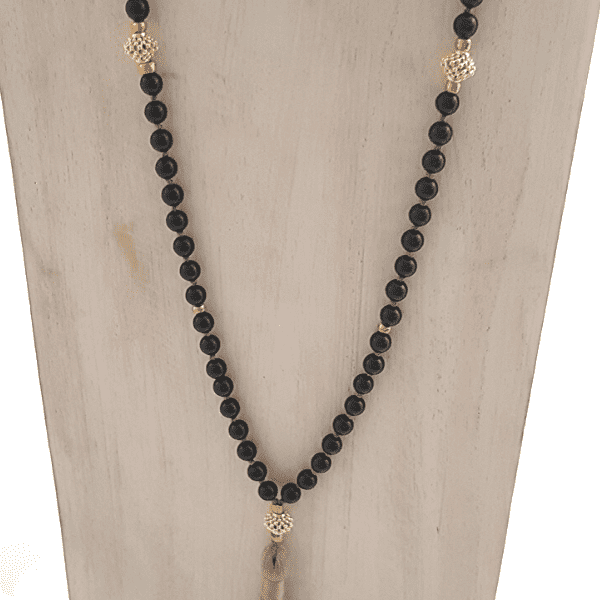 Close up of handmade Black Tourmaline Protection Mala necklace on jewellery bust