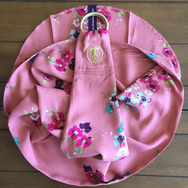 Pink lotus mediation wrap with flower pattern curled on table