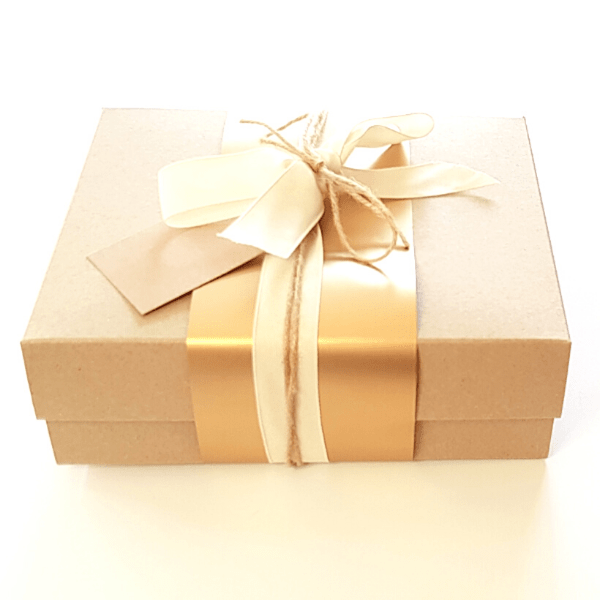 Kraft gift box with gold belli band tied with jute tie and white ribbon with Kraft gift tag