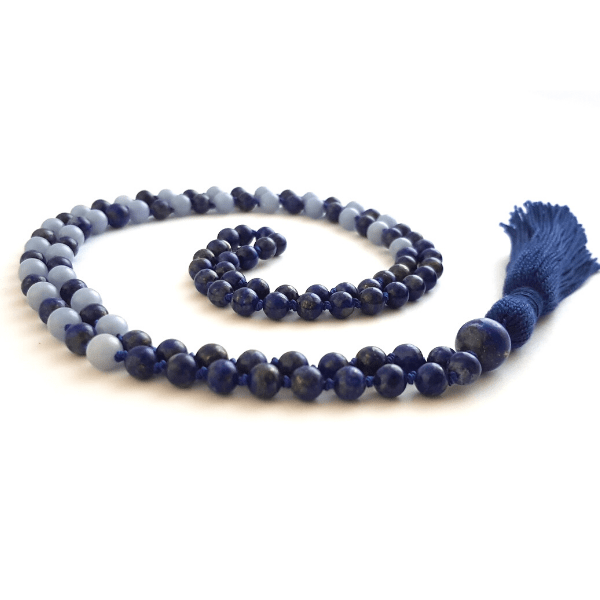 Handmade Lapis Lazuli and Angelite Third Eye Mala Necklace curled on table