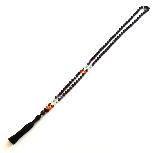 Handmade Chakra Balancing Mala Necklace – 7 Chakra Stones & Lava stretched on table