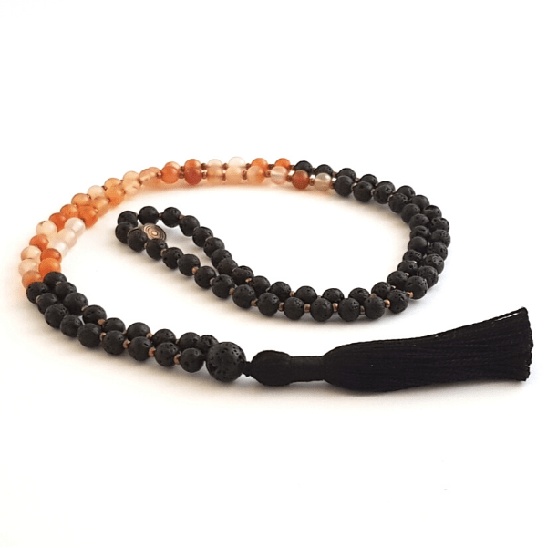 Handmade Creativity Mala Necklace – Carnelian & Lava for Passion & Energy curled on table