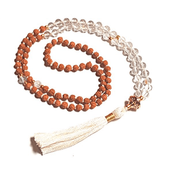 Handmade Energising Mala Necklace – Quartz & Rudraksha with gold filigree bead curled on  table