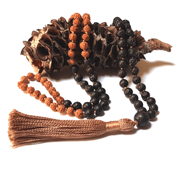 Handmade Grounding Mala Necklace – Lava & Rudraksha for Stability laid on a wooden cone