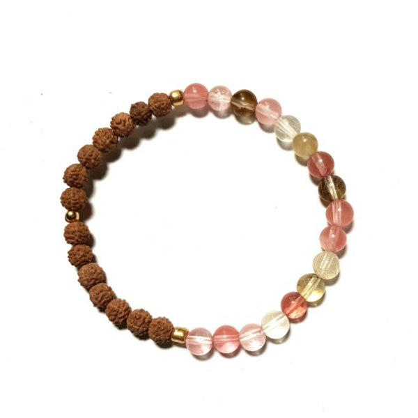 Overhead shot of Handmade Harmonising Bracelet – Tourmalinated Quartz & Rudraksha for Peace on white background with white background