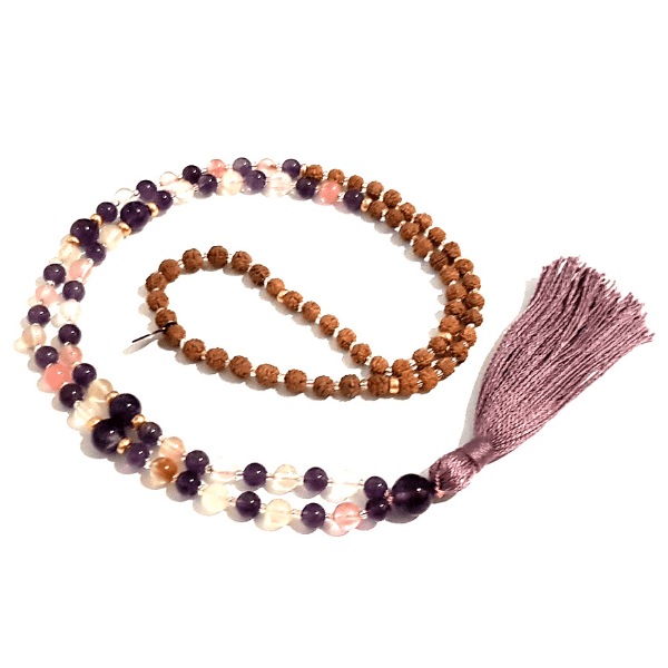 Handmade Resilience Mala Necklace – Amethyst & Tourmalinated Quartz curled on table