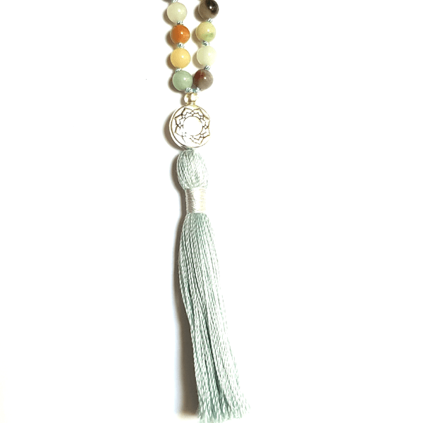 Close up of handmade Amazonite Hope Mala necklace Lotus guru bead