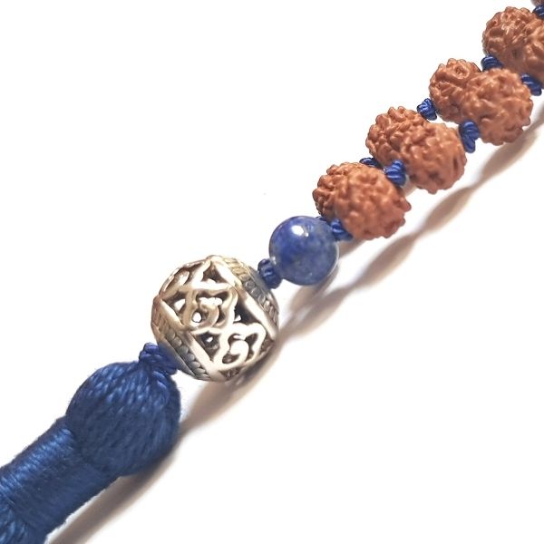 Close up of Handamde Rudraksha and Lapis Lazuli Insight Mala necklace silver filigree guru bead 