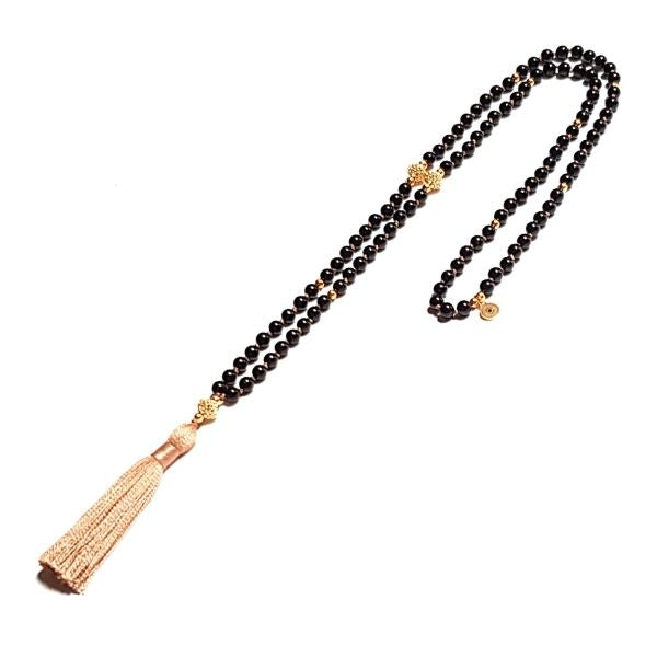 Handmade Black Tourmaline Protection Mala necklace looped on table
