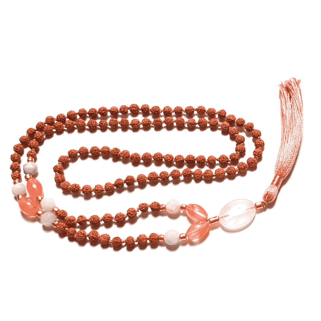 Handmade Tourmalinated Quartz, Rudraksha, Rose Quartz and Amazonite Mala necklace Rose Quartz guru bead curled on table
